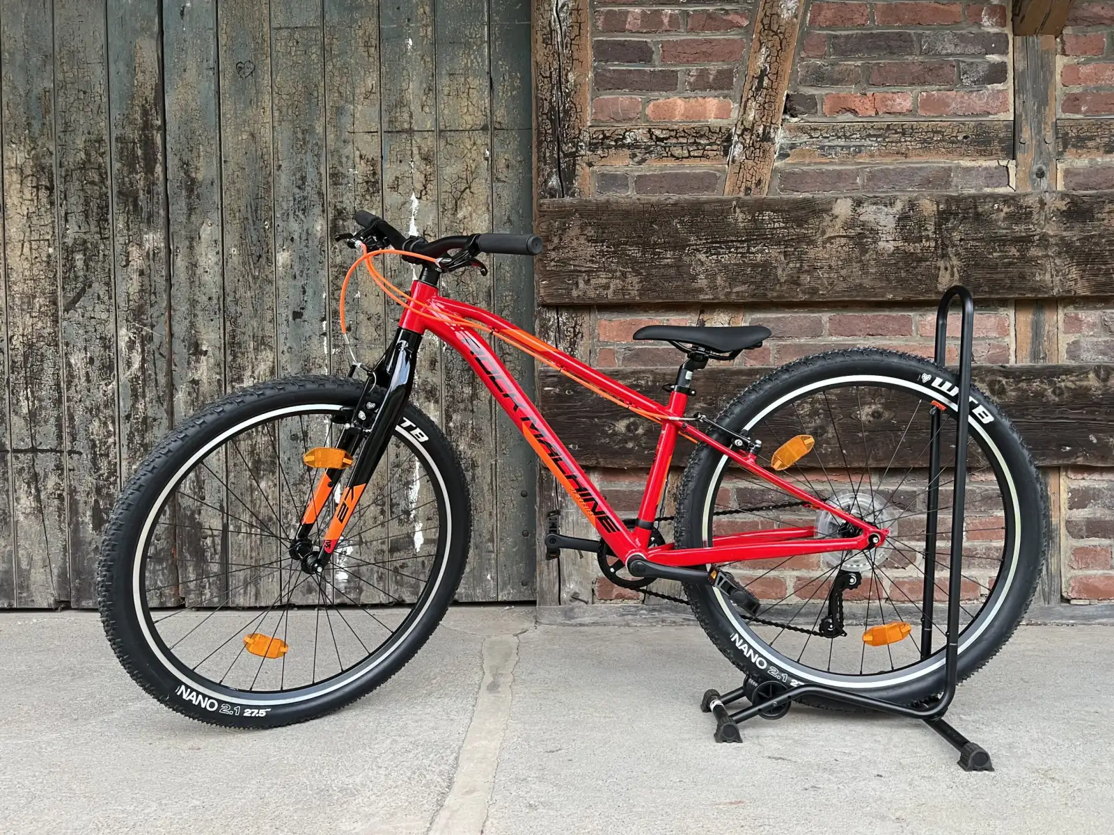 Rock Machine Thunder 27 VB červená/oranžová detský horský bicykel