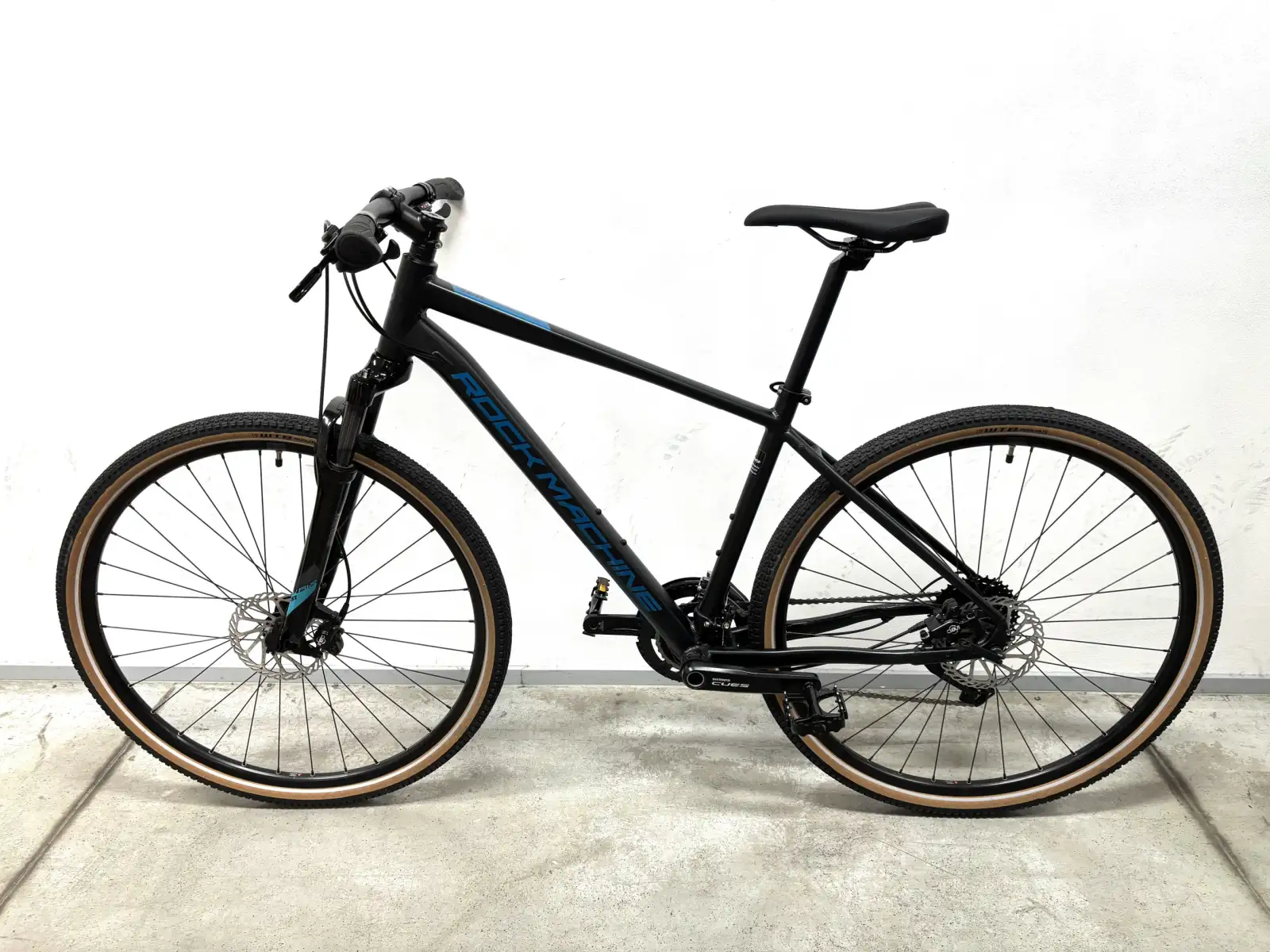 Rock Machine CrossRide 700 trekingový bicykel black/petrol VZOROK