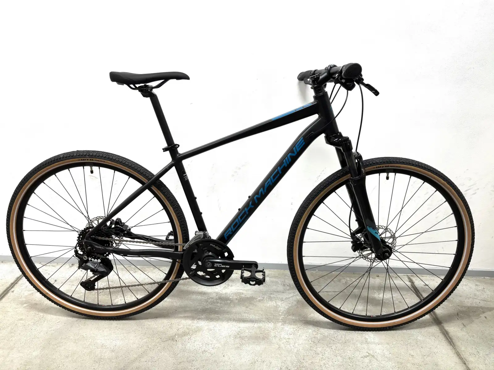 Rock Machine CrossRide 700 trekingový bicykel black/petrol VZOROK